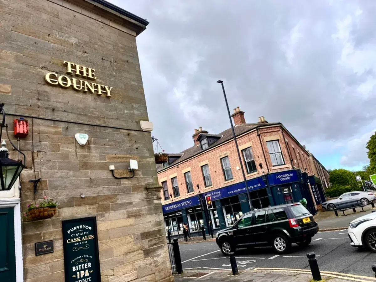 The County viewed from the High Street, showing the gold signage and cask ale board